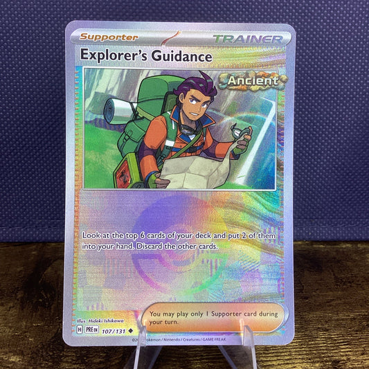 Pokemon Prismatic Evolutions - Explorer’s Guidance - 107/131 - Pokeball Reverse