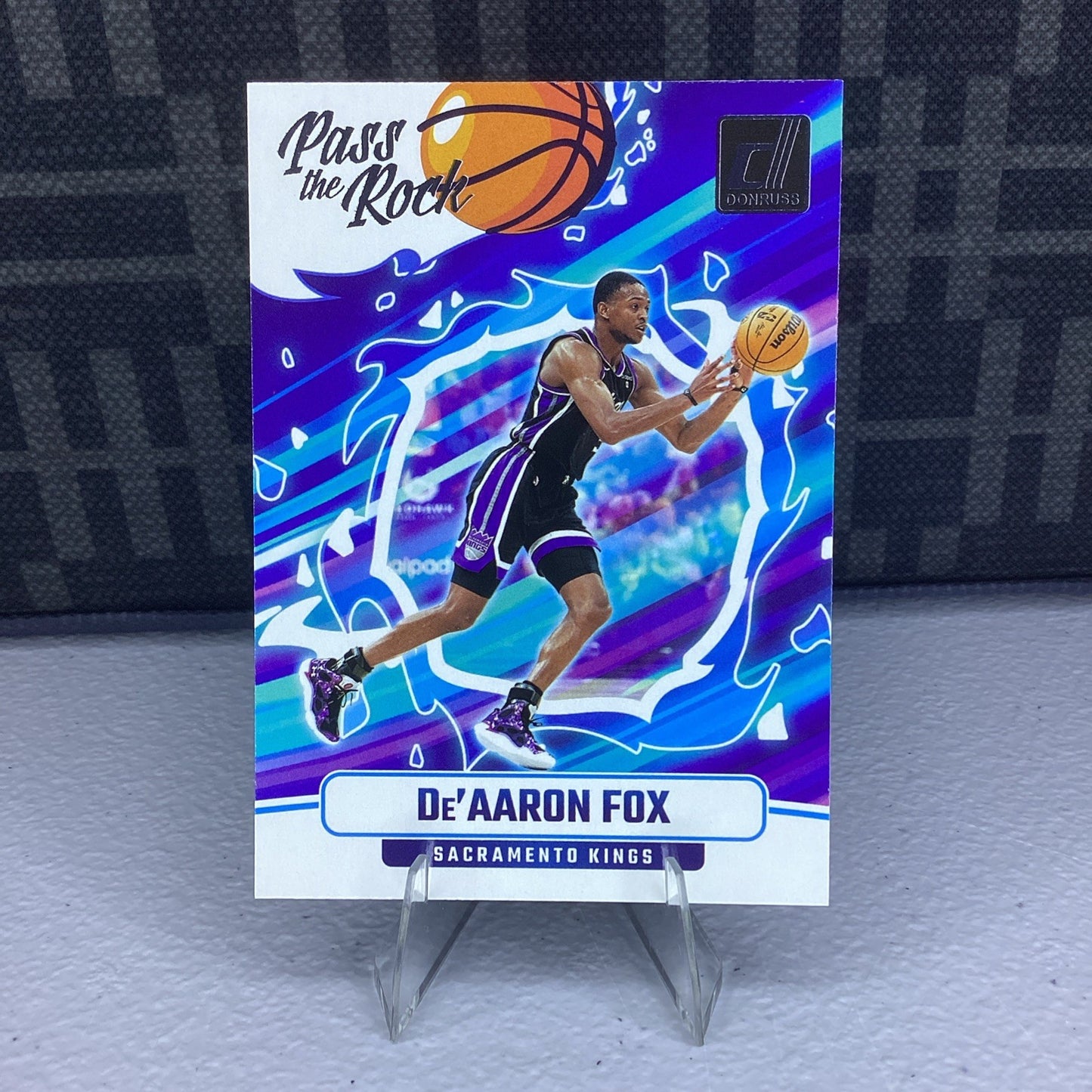 2024-25 Panini NBA Donruss Edition Pass The Rock Insert SP De'Aaron Fox