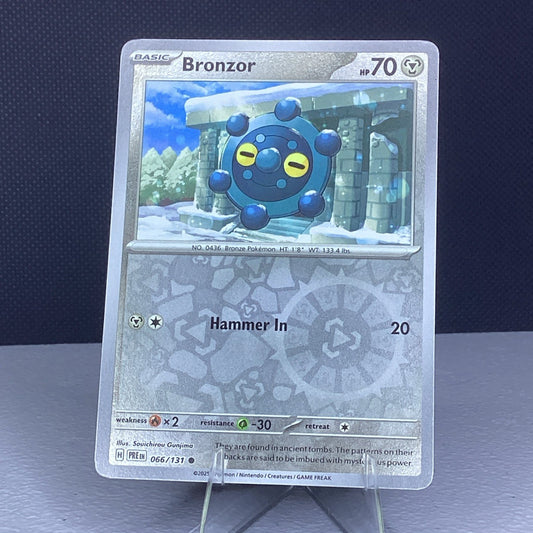 Pokemon Bronzor 066/131 Prismatic Evolutions Reverse Holo Card